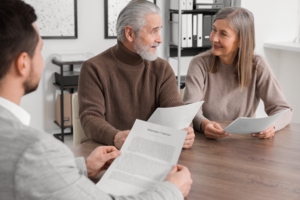 csp-elderly-couple-consulting-insurance-agent-about